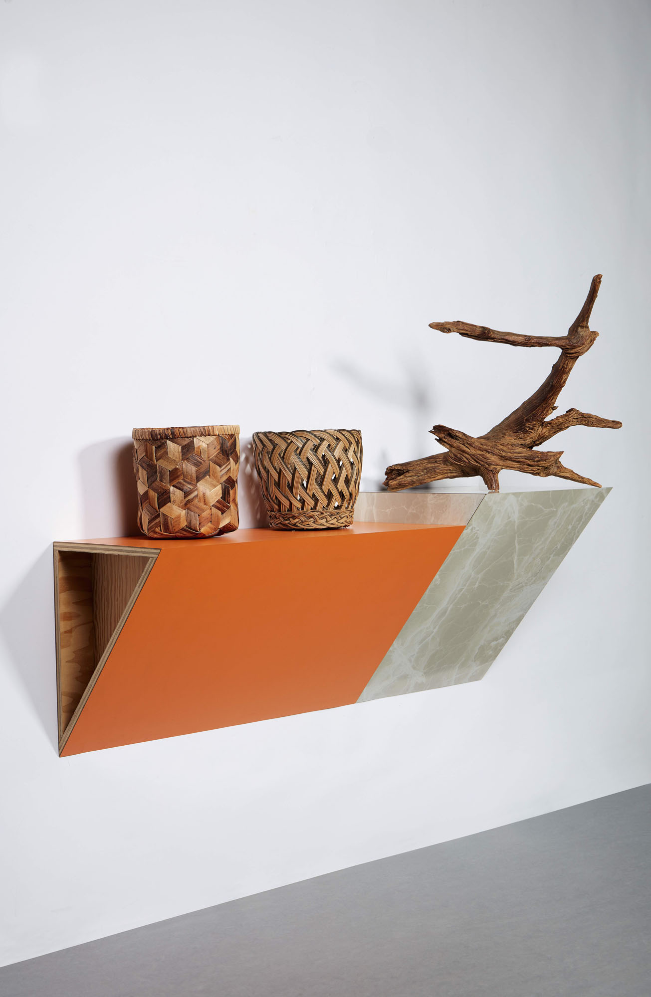 Haim steinbach country weave, 1985, signed and dated ’85, on verso of shelf plastic laminated wood shelf, 2 wicker baskets and driftwood, 110.49 × 144.15 × 63.5 cm, unique